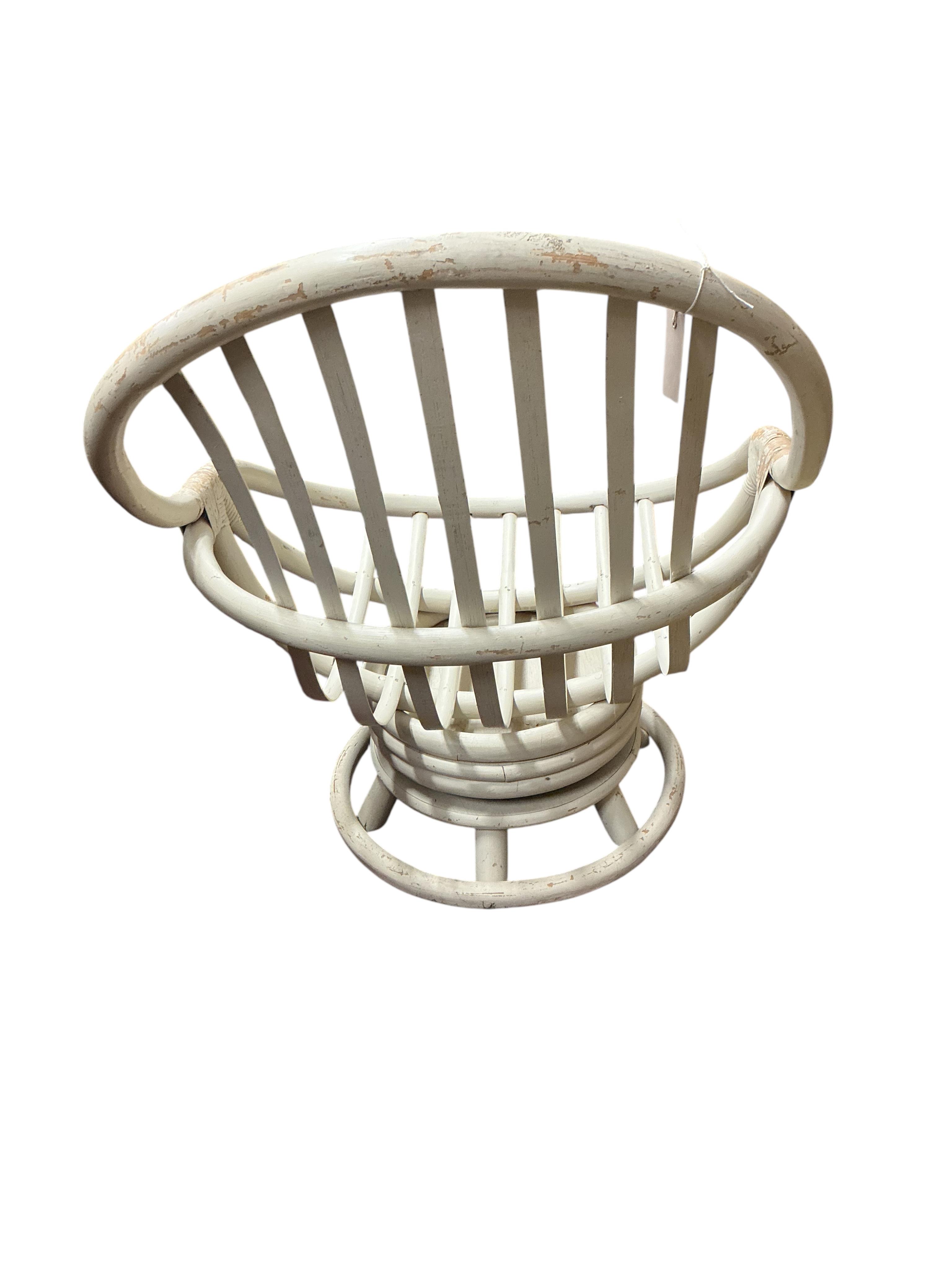 A mid century painted bent cane swivel chair, width 76cm, depth 76cm, height 96cm